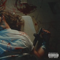 a man laying on a bed with blood on his face