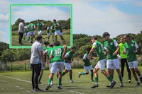 a group of soccer players on a field