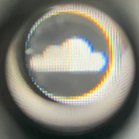 an image of a cloud through a lens
