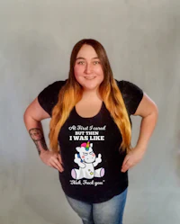 a woman wearing a t - shirt with a unicorn on it