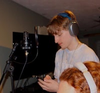 a man and a woman in a recording studio