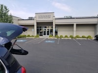 a car parked in front of a building