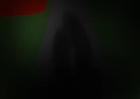 a shadow of a person walking down a dark street