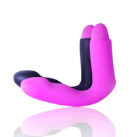 a pink and black sex toy on a white surface