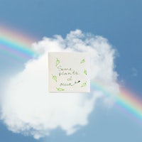 a notepad with a rainbow and leaves in the sky