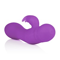 a purple sex toy on a white surface