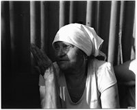 an old woman with a hat on her head