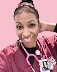 a woman with a stethoscope and a pink background