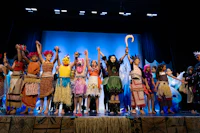 a group of people in costumes on a stage
