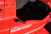 a red racing car with a steering wheel and steering wheel