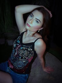 a woman is posing for a picture