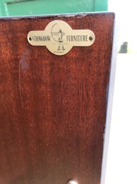 a wooden cabinet with a label on it