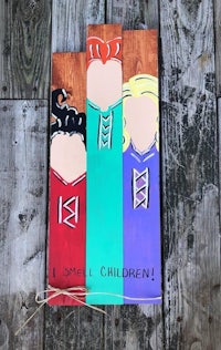 three wooden signs with the words i smell children on them