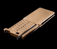 a gold phone with a black cover on a black background