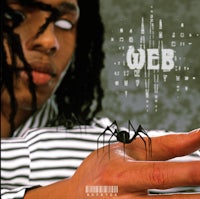 a man with dreadlocks holding a spider