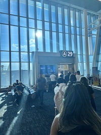 a group of people sitting at an airport
