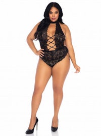 a plus size woman in a black lace lingersuit