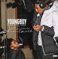 the cover of youngboy's album with a young boy sitting in front of a microphone