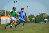 a group of people playing soccer on a field