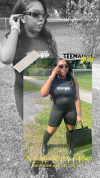 a woman in a black shirt and black shorts is holding a purse