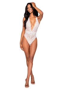 a woman wearing a white lace bodysuit