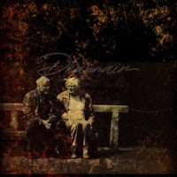 an old couple sitting on a bench