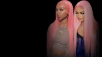 two women with pink wigs standing next to each other