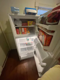 a refrigerator with a lot of food in it