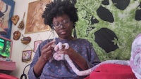 a woman is knitting a stuffed animal