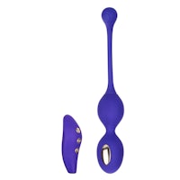 a purple sex toy with a button on it