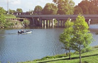 a group of people on a boat on a river
