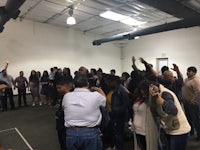 a group of people standing in a room