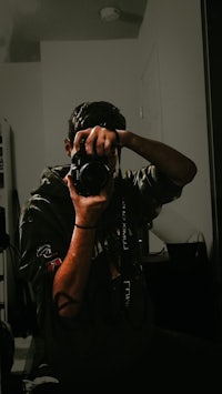 a man taking a picture of himself with a camera