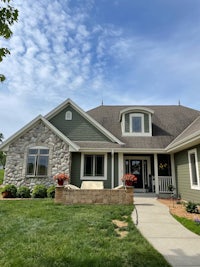 a home with a large front yard and green grass