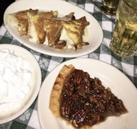 three plates of food on a table with whipped cream and pecan pie