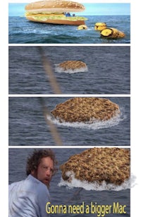 a man is in the water with a hot dog in his mouth