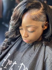 a woman is getting her hair done in a salon