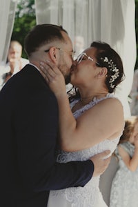 a bride and groom kissing