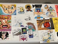 a table with a lot of drawings on it