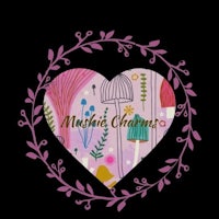 a heart shaped frame with the words mukhi charms on it