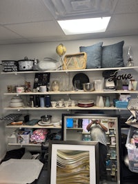 a room with a lot of items on shelves