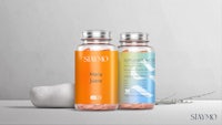 a bottle of vitamin c and a bottle of water next to each other