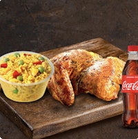 chicken and rice with coca cola on a cutting board
