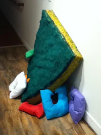 a pile of pillows on the floor