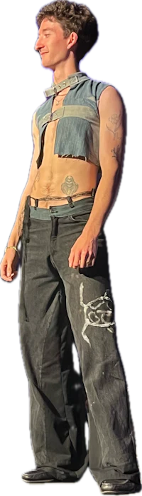 a man with tattoos standing in front of a camera