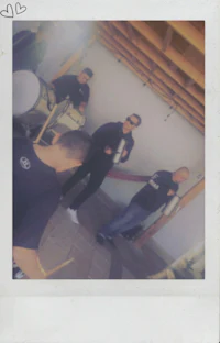 polaroid photo of a group of people playing drums