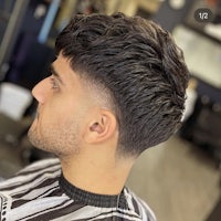a man with a short haircut in a barber shop