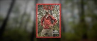 a magazine cover with a man in a red jacket standing in the woods