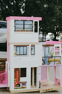 a pink and white toy house