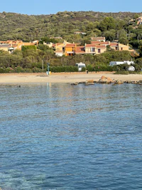 a beach with a boat in the water